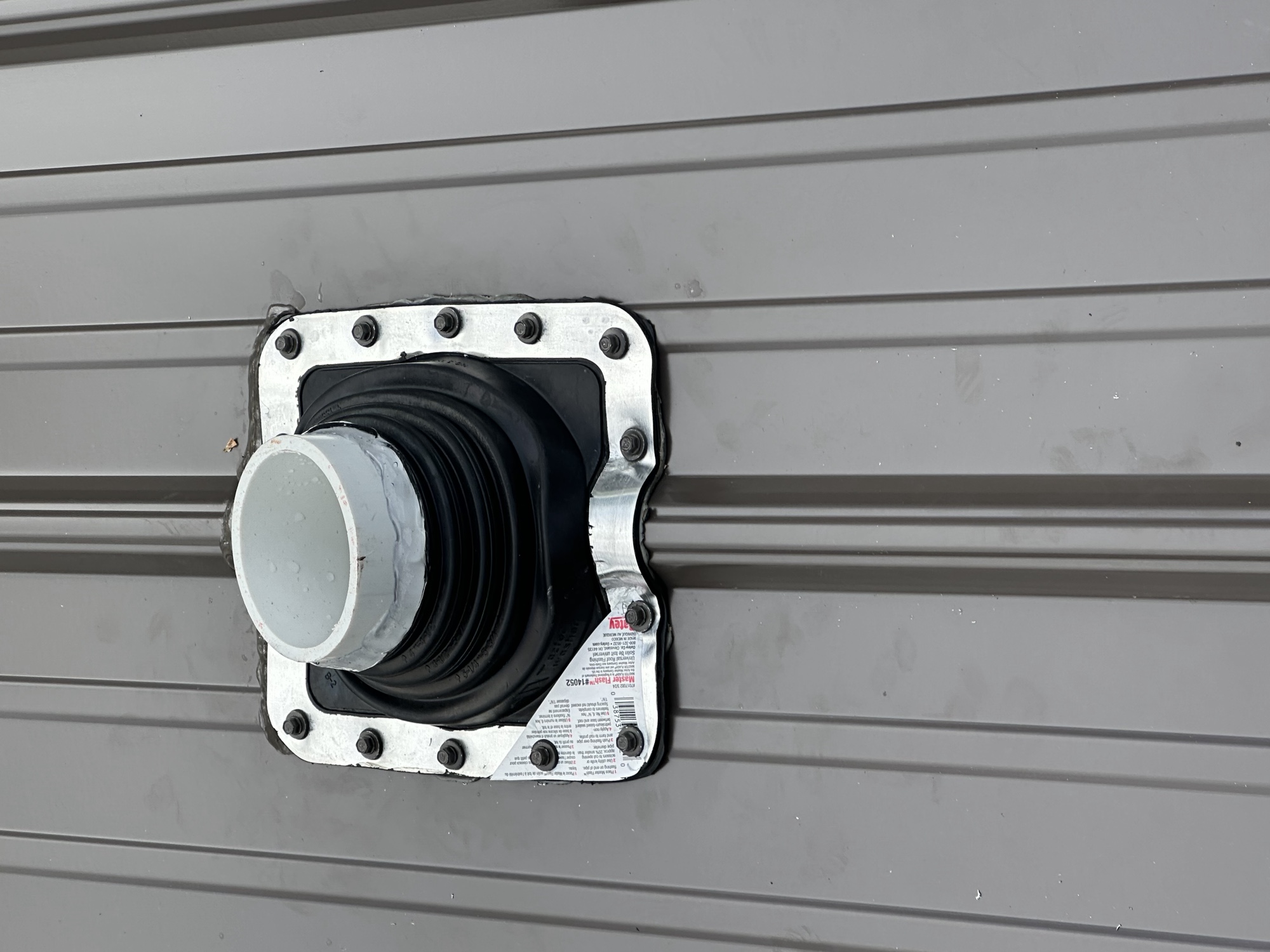 Sealed pipe boot flashing detail on a metal roof